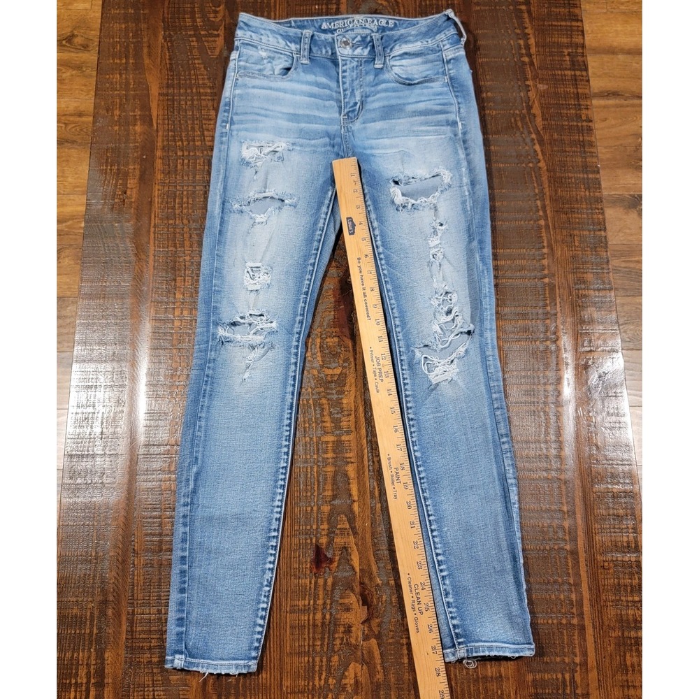 American Eagle Sz 4 Jegging Super super Stretch X Distressed Light Wash Jeans